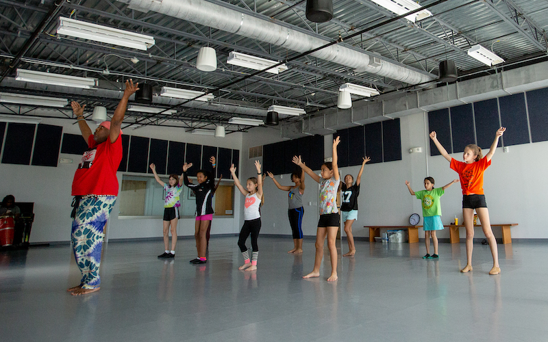 Dance Camp students being led by an instructor