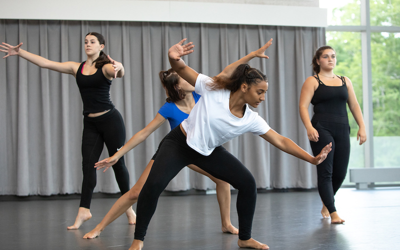 Four students rehearsing in a studio