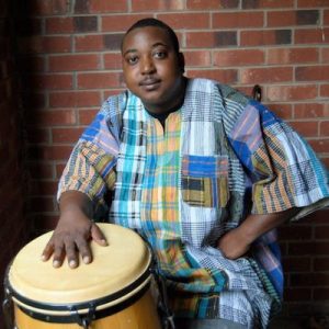 Atiba Rorie with a conga drum
