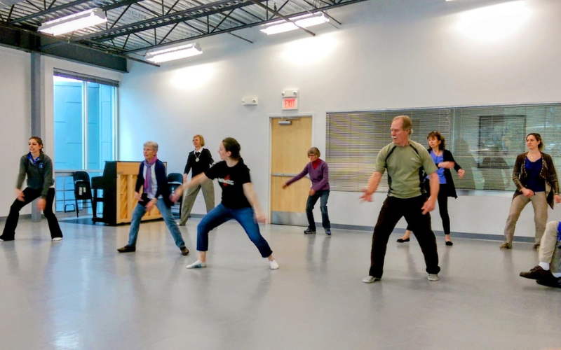Students moving in a Dance for Parkinson's class