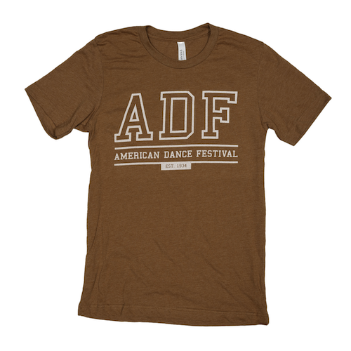 An orange shirt with big ADF letters. Underneath it says American Dance Festival Est. 1934
